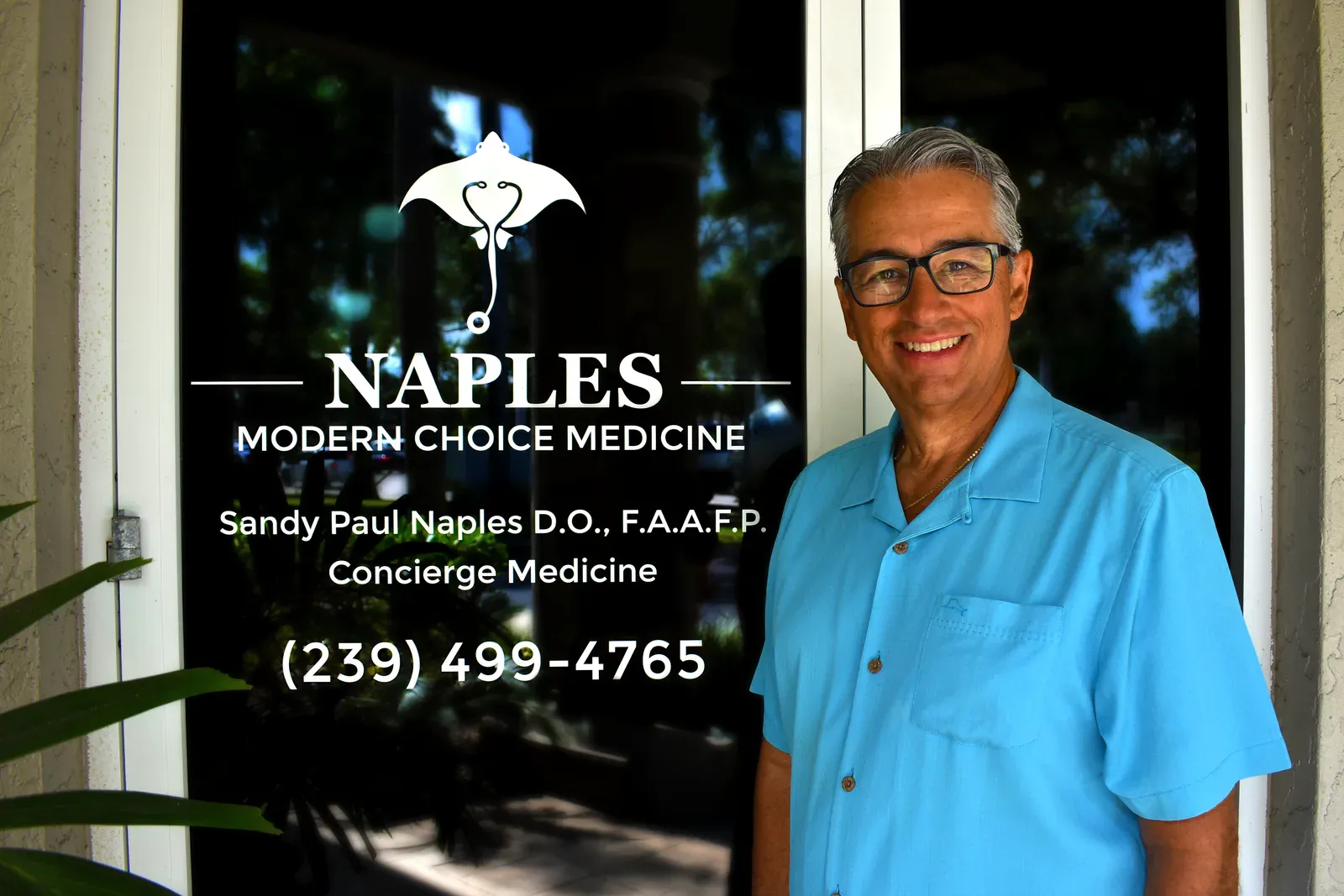 Dr. Sandy Naples at the practice entrance